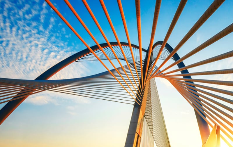 Spiral structure of a bridge against a sunny sky